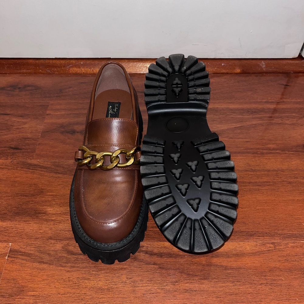 Brown leather chunky platform loafers with gold chain detail